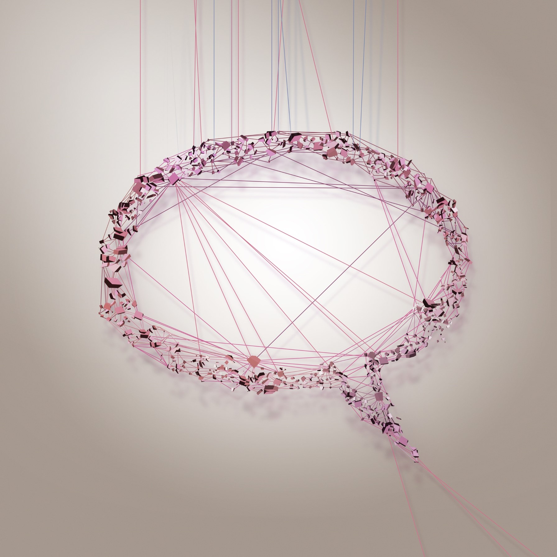 En pratbubbla i form av linjer i rosa färg på grå bakgrund
